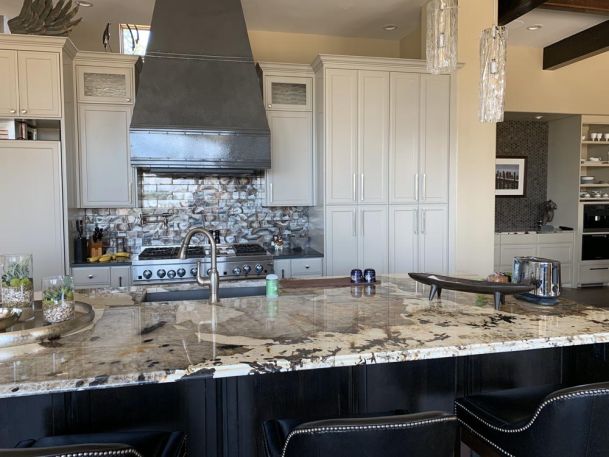 kitchen with granite countertops and white cabinets